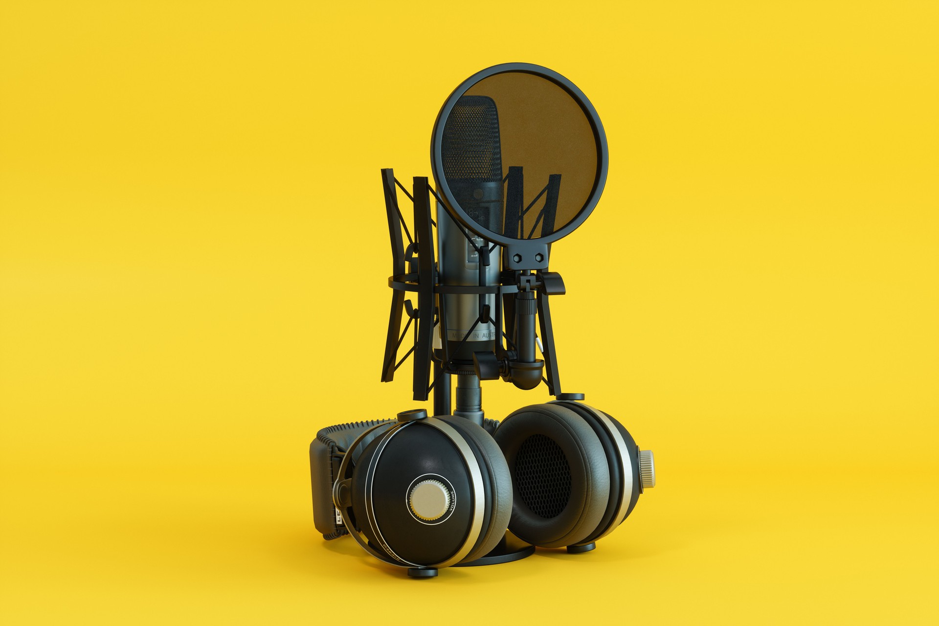 Close-up Of Podcast Microphone And Headphones On Yellow Background
